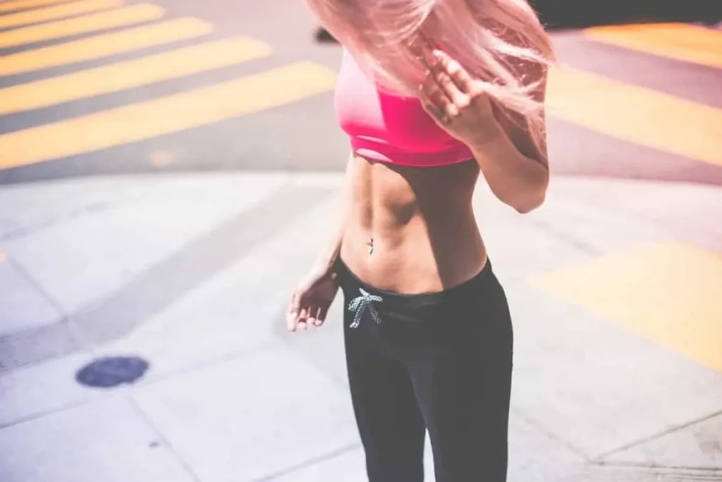 Woman with toned stomach after LA-EMS Body Sculpting Treatment Perivale